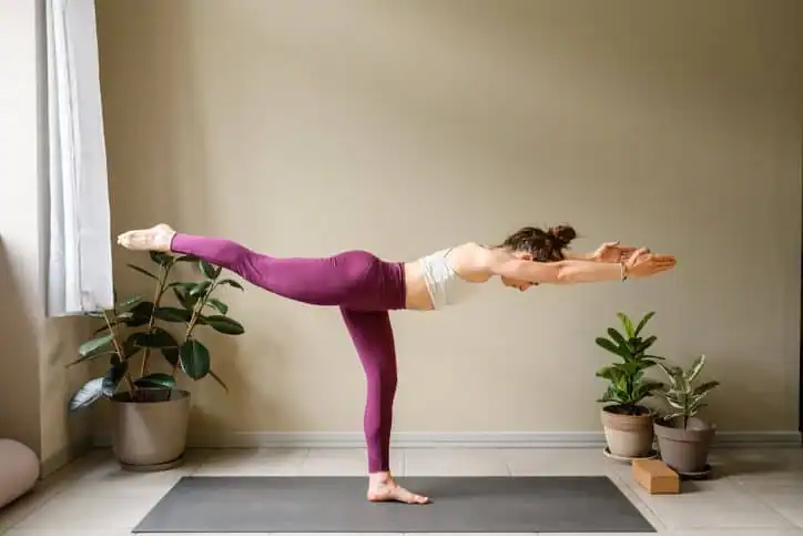 Achieving the Perfect Tone: How Often Should You Exercise for Results? 1 Woman doing Yoga exercise Twickenham to help with toning the body.
