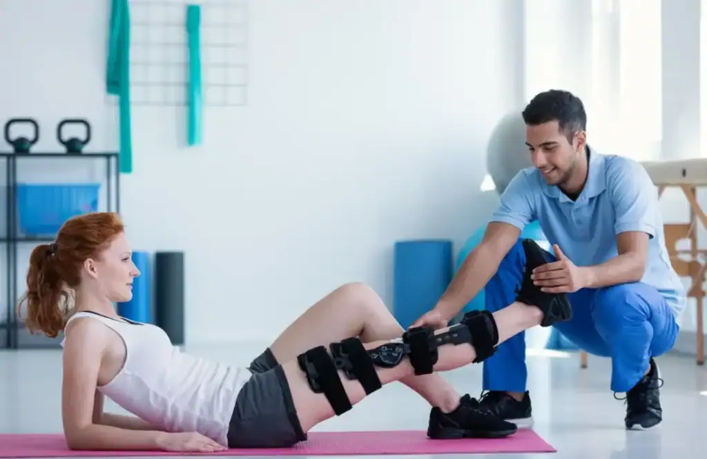 Debunking Meal Timing Myths: The Truth About Muscle Recovery 1 Woman having treatment to help muscle recovery Twickenham after an injury